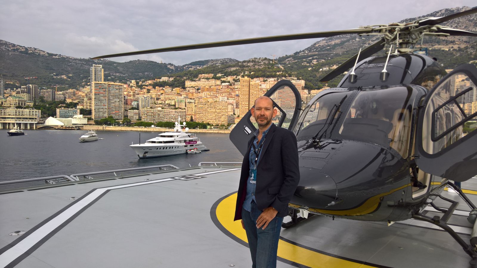 Charles Bradley beside a helicopter in Monaco